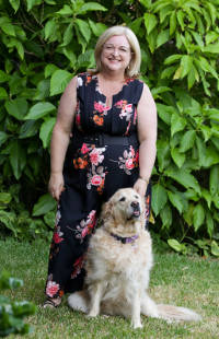 Amy, with her therapy Dog, Bella.